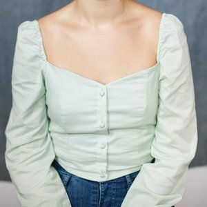 Pale green bustier top